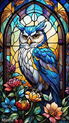 a stained glass window with an owl sitting on it's perch in front of flowers