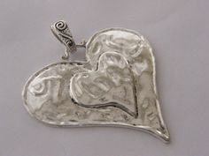 1 Heart pendant 65 x 60mm Lead safe, nickel safe and cadmium safe zinc based alloy Silver Heart Jewelry With Large Pendant, Valentine's Day Silver Jewelry With Large Pendant, Silver Jewelry With Large Pendant For Valentine's Day, Antique Silver Nickel-free Heart Pendant, Antique Silver Heart-shaped Nickel-free Jewelry, Antique Silver Heart Jewelry With Oxidized Finish, Silver Heart Pendant Jewelry With Oxidized Finish, Silver Oxidized Heart Pendant Jewelry, Heart Pendant