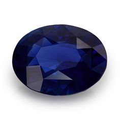 an oval shaped blue sapphire stone on a white background with clippings to the side