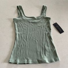 Nwt Beautiful Sage Colored Tank, Ribbed Texture, Square Scoop Neckline. A Basic Addition To Your Wardrobe! Easy To Dress Up With A Cute Skirt Or Dress Down Under A Cozy Sweater Or Flannel! Spring Ribbed Camisole Top, Ribbed Camisole Tops For Spring, Casual Green Camisole With Scoop Neck, Trendy Green Tops With Tank Straps, Casual Green Scoop Neck Camisole, Summer Ribbed Camisole Top, Summer Tops With Stretch And Tank Straps, Summer Stretch Tops With Tank Straps, Green Ribbed Scoop Neck Top