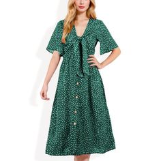 The Anna-Kaci Women's Polka Dot Midi Dress combines a playful polka dot print with timeless elegance. Featuring a stylish front tie detail and a button-front design, this dress offers a flattering silhouette that enhances your figure. The lightweight fabric and short sleeves make it comfortable for warm-weather wear, while the midi length adds a touch of sophistication. Ideal for casual outings, brunch dates, or special occasions, this versatile dress is a must-have for any wardrobe. Polka Dot Midi Dress, Brunch Dates, Midi Slip Dress, Weather Wear, Midi Short Sleeve Dress, Women Midi, Versatile Dresses, Polka Dot Print, Front Design