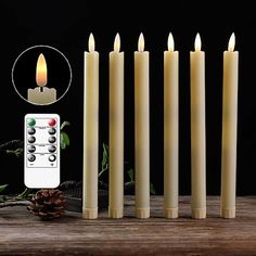 six candles with remote control on wooden table