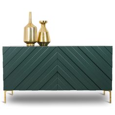 a sideboard with two gold vases on top and one green cabinet below it