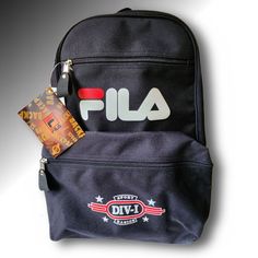 Boy's Black Fila Backpack Style No. Kf-7717, Nwt, Light Weight And Durable, Ideal For Back To School Large Main Compartment Logo Accented Front Zipper Closure Two Large Zippered Front Compartment Adjustable Padded Shoulder Straps Reinforced With Rivets Inside Key Holder Feature For Convenience Waterproof 600d Polyester Approx. Mea. H 17" X W (Top 9" Bottom 13") X D 4" Made In China Feel Free To Contact Me If You Have Any Questions. Thanks For Stopping By! Casual Backpack With Letter Print For Back To School, Casual Letter Print Backpack For Back To School, Back To School Standard Backpack With Logo, Trendy Black Bag For End Of School Year, Black Bag With Logo For Back To School, Black Bags With Logo For Back To School, Black Letter Print Bag For Back To School, Black Bags With Letter Print For Back To School, Casual Black Backpack With Logo