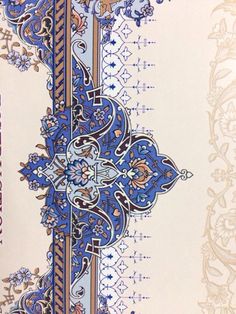 an intricately designed wallpaper with blue and gold designs on it's border