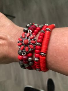 This beautiful bracelet has 5 rows of red stones and adds a feminine touch with a red flower design placed very classily on the bracelet. Add this bracelet for a punch of color to any denim and t-shirt outfit or many other outfit styles for that matter. Red Multi-strand Beaded Bracelets, Red Bohemian Flower Beaded Bracelets, Bohemian Red Flower Bracelets, Red Flower-shaped Bohemian Beaded Bracelets, Bohemian Red Flower Beaded Bracelet, Red Flower Design, Long Turquoise Necklace, T Shirt Outfit, Red Stones