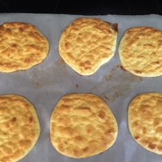 six biscuits on a baking sheet ready to be baked