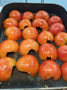 several tomatoes have been peeled and placed in a pan