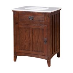 a wooden sink cabinet with a white counter top