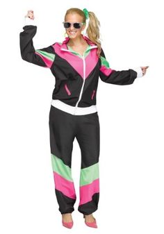 a woman in a pink, black and green outfit with sunglasses on her head is dancing