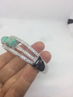 Gorgeous romantic wide Victorian style Bangle bracelet Sterling Silver Rhodium finished White sapphire and Persian Turquoise filigree work 7.5 inches long 1 inch wide All jewelry is shipped in a nice gift box. Check out our over a THOUSAND great reviews Engraving is $4 per letter and is not always perfect depending on the piece. It can take a few days if the jeweler is busy. This is payable to Paypal Judithsltd@gmail.com Persian Turquoise, Turquoise Crystal, Crystal Bangle, Sterling Silver Filigree, Bracelet Sterling Silver, Vintage Victorian, Silver Filigree, White Sapphire, Victorian Style