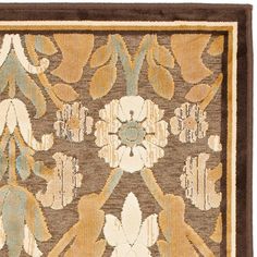 an area rug with flowers and leaves in brown, beige and green colors on a white background