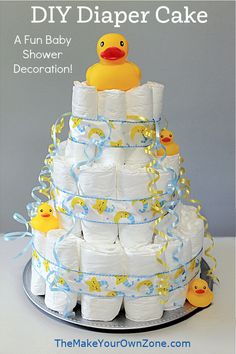 a diaper cake made to look like a rubber ducky on top of it