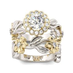 two tone gold and silver wedding ring set with flowers on each band, surrounded by diamonds