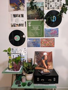 there are many records on the wall with plants