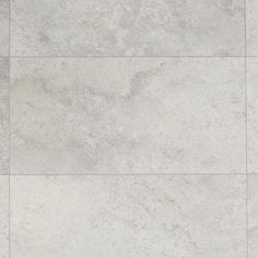 a white tile floor with grey grouting