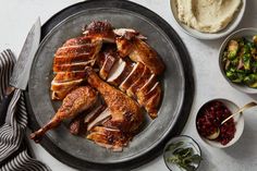 a plate with meat, mashed potatoes and cranberry sauces on it