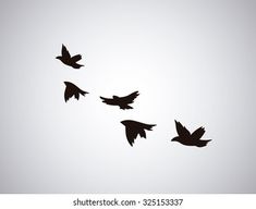 black birds flying in the sky on a gray background