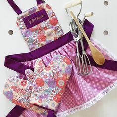 an apron and utensils are sitting on a table