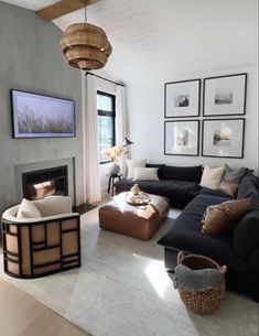 a living room filled with furniture and a fire place in front of a large window