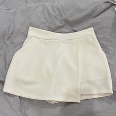 Cream Skort. New With Tags. Xs Trendy Short Skort With Built-in Shorts, White Mini Shorts With Pockets, High-waisted Skort With Pockets For Day Out, Forever 21 White Shorts For Spring, Trendy Short Skort For Day Out, Chic Mini Bottoms From Forever 21, Forever 21 Short Bottoms With Pockets, Forever 21 Mini Skirt With Pockets, Forever 21 Shorts With Pockets