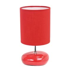 a red table lamp on a white background