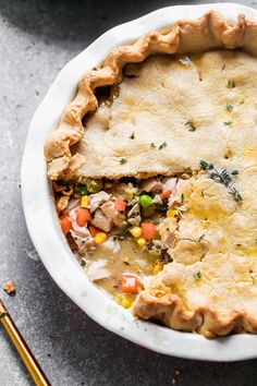 a chicken pot pie with a slice missing from it