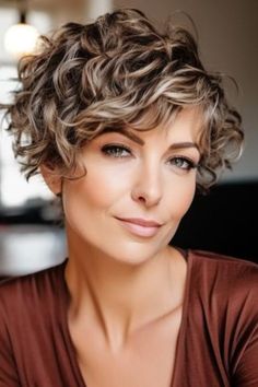 Noble chic curly layered pixie is a high, restless, curly haircut for women who want a daring and practical style. This is a short, curly hairstyle for women that accentuates your natural curls with extra volume and texture. Click here to check out more best curly hairstyles for women over 50. Short Curly Wedge Hairstyles, Gray Curly Pixie Haircut, Curly Wedge Haircut Stacked, Pixie Permed Hair, Short Curly Gray Hair Over 50 Curls, Short Curly Hair Over 50 Women, Short Curly Hairdos, Short Pixie Cut Curly Hair, Short Haircuts For Women Over 60