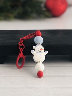 a key chain with a snowman hanging from it