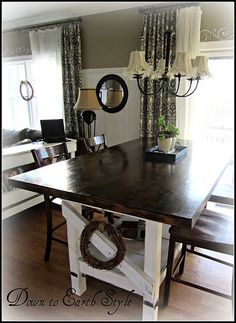 a dining room table with two chairs around it