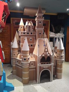 a castle made out of cardboard sitting on the floor