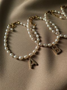 If you are looking for an elegant and unique bridesmaid gift for wedding or bachelorette party - this dainty pearl bracelet with initial letter is an ideal choice! Each bracelet is adorned with a delicate initial letter, adding a unique touch that makes it a treasured keepsake. Your bridesmaids will feel truly special as they receive these timeless jewelry pieces. This elegant pearl bracelet is crafted of carefully selected natural freshwater pearls and features a beautiful golden-plated letter Bridesmaid Gifts From Bride, Bridesmaid Pearl Bracelet, Bridesmaid Gifts Unique, Bachelorette Party Favor, Unique Bridesmaid, Bridesmaid Pearls, Pearl Jewelry Wedding, Bridesmaid Proposal Gifts, Proposal Gifts