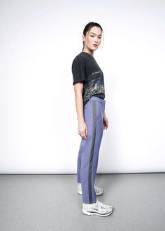 Cropped at the ankle, the Empower Slim Crop Pant has the perfect combination of soft, stretchy, breathable material and a tailored mid rise fit. Now featuring a classic inset 'tuxedo' stripe, this item is a true closet must-have. Mix and match with other items in the Empower Collection for maximum versatility. Athleisure Straight Leg Bottoms With Side Stripes, Sporty Straight Leg Bottoms With Contrast Stripes, Fitted Bottoms With Side Stripes For Streetwear, Sporty Fitted Pants With Elastic Side Panels, Fitted Bottoms With Contrast Stripes For Spring, Athleisure Work Pants With Elastic Side Panels, Athleisure Pants With Contrast Stripes For Spring, Fitted Bottoms With Elastic Side Panels For Streetwear, Spring Athleisure Pants With Contrast Stripes