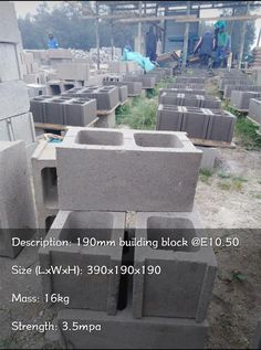 several cement blocks stacked on top of each other in the middle of a construction site