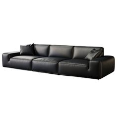 a black leather couch with pillows on it's back end and armrests