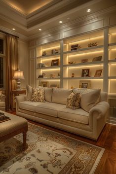 a living room filled with furniture and bookshelves in the wall mounted bookcases