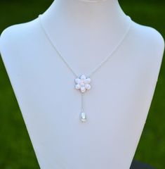 "2018 Collection, MORNING HEIRLOOM Y NECKLACE COLLECTION Featuring hand sculpted white Gardenia and tear drop pearl necklace. Details : - Gardenia made from baking polymer clay. -Flower size approx : 22-23mm - Flower glued on metal plated over brass filigree. - Entire length ; 16 inches + 2 \" extender. Finish with lobster clasp. - Chain finish available in silver plated, antiqued brass, gold and rose gold. - Sterling silver and gold filled chain available with additional cost, ( the filigree in Drop Pearl Necklace, Baking Polymer Clay, White Gardenia, Brass Filigree, Pearl Drop Necklace, Clay Flower, Necklace Collection, Y Necklace, Necklace White