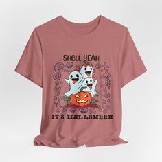 Get into the Halloween spirit with this fun and quirky "SHELL YEAH IT'S A HALLOWEEN" t-shirt! Featuring eight expressive pumpkin faces, each showing a different emotion, this shirt perfectly captures the spooky and playful vibes of the season. Whether you're at a Halloween party, trick-or-treating, or just lounging in fall fashion, this comfy and stylish graphic tee is sure to bring the fun. Perfect for pumpkin lovers, Halloween enthusiasts, and those who enjoy a bit of humor in their holiday wa Halloween Novelty T-shirt With Graphic Print, Funny Halloween T-shirt With Screen Print, Funny Halloween T-shirt With Short Sleeves, Funny Halloween T-shirt With Letter Print, Halloween Graphic Tee With Slogan, Halloween Slogan Graphic Tee, Casual Halloween Slogan T-shirt, Funny Orange Short Sleeve T-shirt, Orange Halloween T-shirt With Funny Print