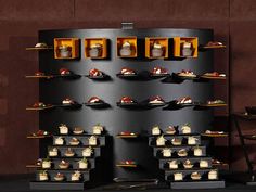 a display case with many different types of desserts on it's sides and shelves