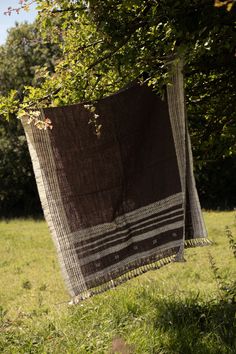 Handwoven woolen shawl/ throw from the Kutch district of Gujarat, India.  These are ideal to keep you warm in winter or as an attractive throw for a sofa or bed. They are beautifully handspun and handwoven. The yarn is undyed so the color is completely natural; The attractive browns and creams are the colour of the sheep's wool. These are sustainable, organic and natural and have been personally and ethically sourced.  size and shade can vary slightly from piece to piece  99cm X 229cm (including Woolen Shawl, Indian Textiles, Natural Colours, Wool Shawl, Vintage Textiles, Sheep Wool, Shawls And Wraps, Yarn Dyeing, Natural Color