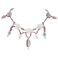 Vintage handmade necklace featuring beautiful designing of rose quartz and amethyst gemstones. This necklace is measured 16 inches long with lobster clasp. The necklace has also been checked for authenticity by a professional. Lavender Handmade Necklace, Handmade Pink Amethyst Necklaces, Handmade Pink Amethyst Necklace, Pink Beaded Amethyst Necklace, Handmade Purple Rose Quartz Jewelry, Wired Necklaces, Amethyst And Rose Quartz, Rose Quartz Necklace, Wire Necklace