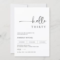 a white card with the word hello thirty written on it and a black calligraphy font