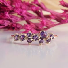 Gold Cluster Wedding Band, Womens Amethyst Cluster Ring, Dainty Cluster Wedding Band, Gold Amethyst Ring, Purple Stone Ring,Amethyst Jewelry WE OFFER UNLIMITED PERIOD INSTALLMENTS PLAN This is a beautiful, stunning, feminine ring that works well for all occasions, styles, and ages. You will love it! Ring information: Stones: Amethyst Approximate size: 3.0mm (1 stone) Approximate size: 2.5mm (3 stones) Approximate size: 2.0mm (5 stones) Metal type: Gold Metal stamp: 14k Gold Installment Payments Fine Jewelry Amethyst Stackable Wedding Rings, Wedding Amethyst Stackable Rings Fine Jewelry, Purple Cluster Ring For Weddings, Fine Jewelry Style, Wedding Amethyst Gemstone Stackable Rings, Amethyst Gemstone Stackable Rings For Wedding, Purple Birthstone Stackable Rings For Wedding, Purple Amethyst Cluster Ring With Gemstone, Purple Multi-stone Cluster Ring For Anniversary, Purple Amethyst Stackable Wedding Rings