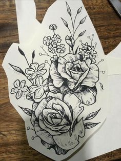 some flowers are drawn on paper with scissors