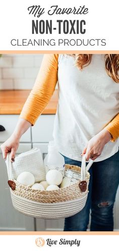 a woman holding a basket filled with cleaning products in her hands and the words, my favorite non - toxic cleaning products