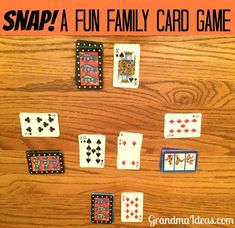 the snap pool is made with playing cards and an arrow pointing to each other on a wooden table