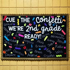 a bulletin board with words written on it in front of a yellow brick wall that says, cue the conflict we're 2nd grade ready