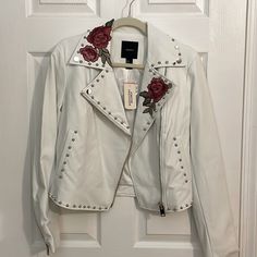 New Forever 21 White Faux Leather Moto Studded Jacket, With Floral Embroidered. Size Small. Asymmetrical Zippered Closure. Zippered Vent Cuffs. Two Silver Tone Zippered Pockets, And One Faux Flap Pocket. The Studs Are Highly Polished. White Polyester Lining. The Approx. Measurements Are Pit To Pit 17.5". Shoulder To Front Hem 20". Shoulder To Shoulder Seams 15". Waist 16" (32"). Pit To Sleeve Hem 18". Shoulder To Sleeve Hem 24". Excellent Condition. New With Tags. Smoke Free Home. Thank You For White Punk Leather Jacket With Long Sleeves, Trendy Embroidered Leather Jacket For Spring, Cropped White Leather Jacket, White Long Sleeve Edgy Biker Jacket, White Long Sleeve Punk Leather Jacket, White Moto Leather Jacket With Zipper Closure, Leather Coat With Fur, Edgy Leather Jacket, Faux Leather Motorcycle Jacket