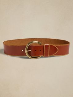 Our designers selected a special quality of leather for this belt, choosing one with a washed finish and beveled edges, anchored by a round buckle in an antique gold finish.  Single buckle closure.  Designed to be worn at the waist.  Designed to be worn at the waist.  Width: 2. 5" (6. 3cm) XXS: 25-29" XS: 27-31" S: 29-33" M: 31-35" L: 34-38" XL: 38-42" XXL: 42-46" Women's Luxury Belts With Gold-tone Hardware, Trendy Belts For Women Gold, Womens Dark Brown Belt, Women Elastic Belts, Womens Leather Belts Jeans, Luxury Brown Belt, Belt For Woman, Trendy Summer Belts, Womens Dressy Belt