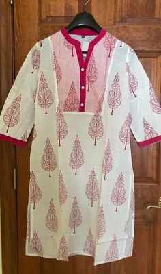 White Straight Kurta Tunic, White Straight Kurta Tops With Printed Motifs, Red Cotton Straight Kurta Tops, White Printed Long Sleeve Tunic, White Printed Tunic Kurta, White Tops With Printed Motifs, Cotton Block Print Tunic, White Block Print Tunic Kurta, White V-neck Kurta With Printed Motifs